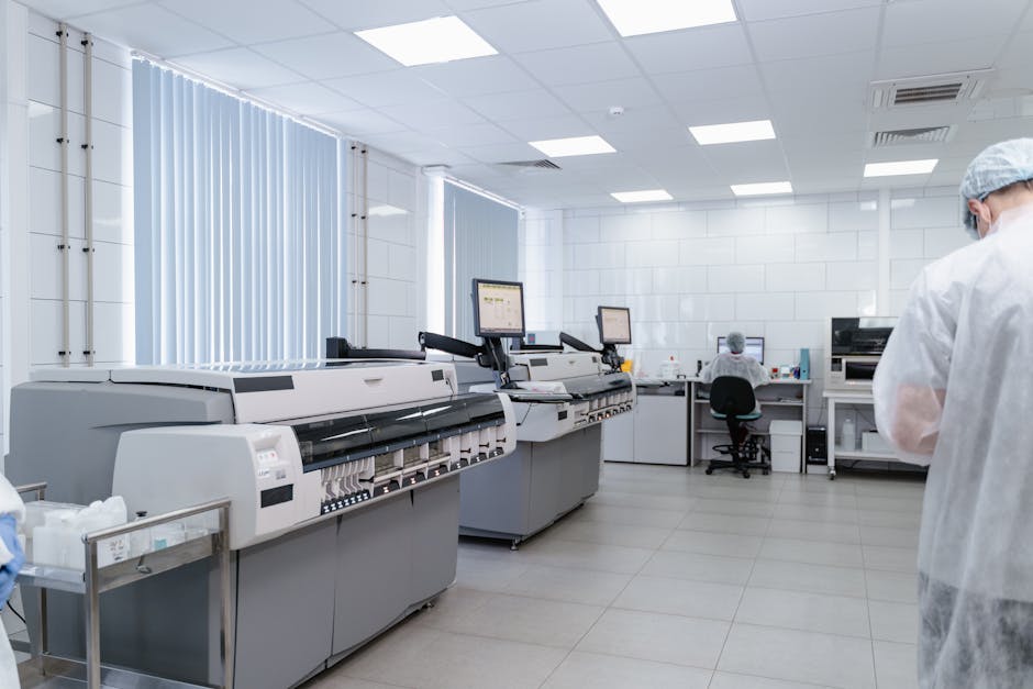 Bright and sterile laboratory featuring high-tech research equipment and professionals at work.